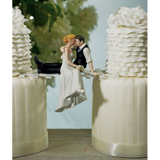 Perfect romantic cake topper. Caught sneaking a kiss, this laid back 